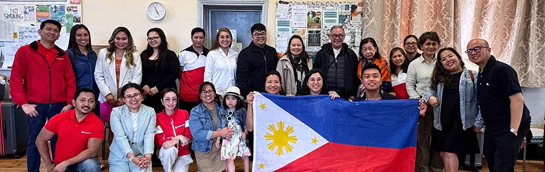 Members of the Filipino Cornwall Community Organisation gathered together with the Philippine flag
